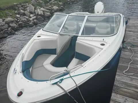 Russ's boat tied up at the dock, bow seating open