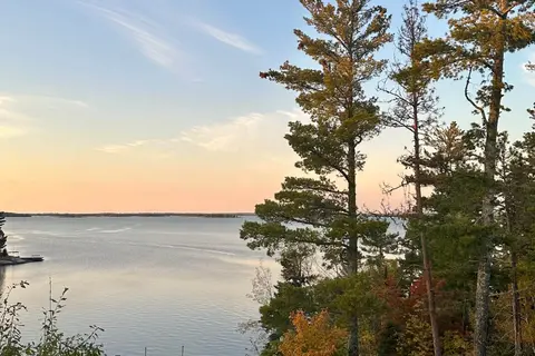 Sunset view over Lake Kabetogama with dock and boat